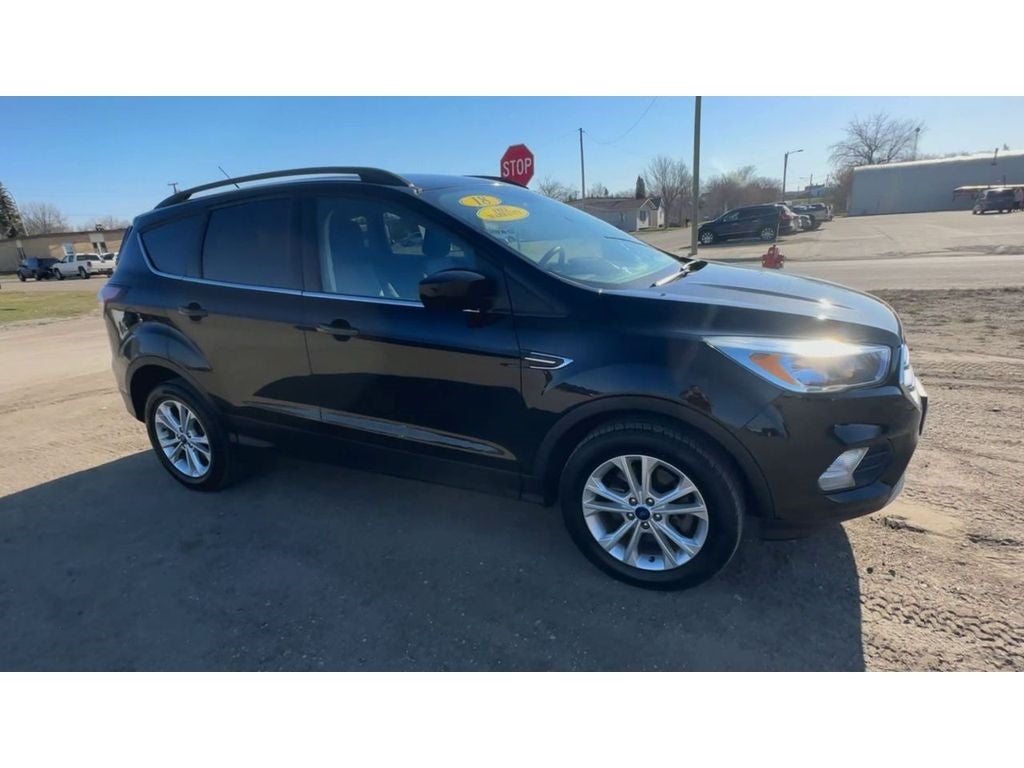 Used 2018 Ford Escape SE with VIN 1FMCU9GD0JUC15978 for sale in Devils Lake, ND
